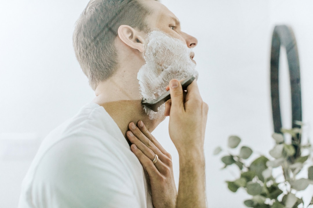 Professional beard grooming tools including safety razor and premium shaving products for beard care