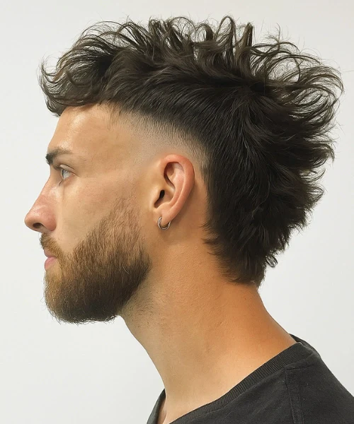 Modern faux hawk hairstyle with subtle taper showing versatile styling options