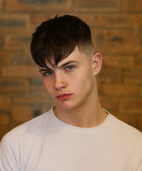 Angular fringe crop with diagonal line and side-swept styling mens Queens 2026