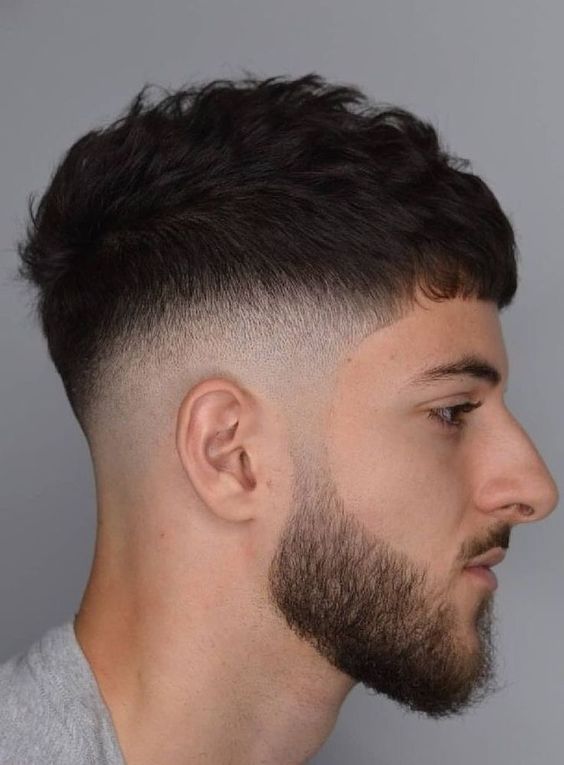Low drop fade with textured crop | curved drop fade haircut following natural head shape with modern textured styling