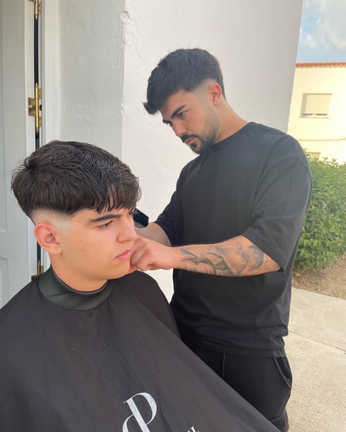Low burst fade haircut | curved burst fade technique wrapping around the ear for mohawk and faux hawk styles