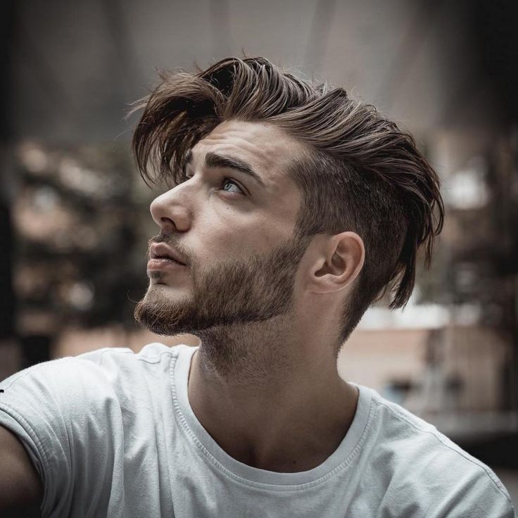 Long top with undercut hairstyle showing dramatic contrast between long hair on top and shaved sides