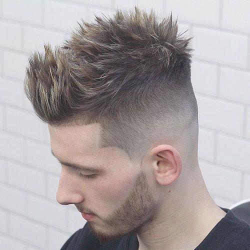 Quiff fade haircut | modern textured quiff with fade sides combining volume and contemporary barbershop style
