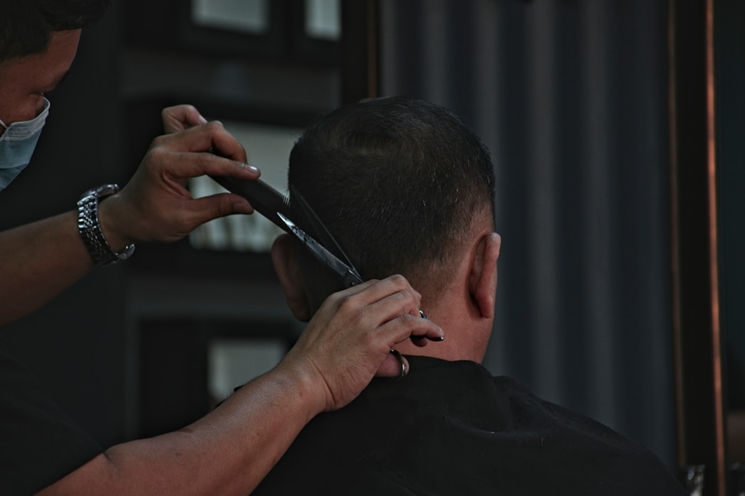Barber cutting professional low fade haircut