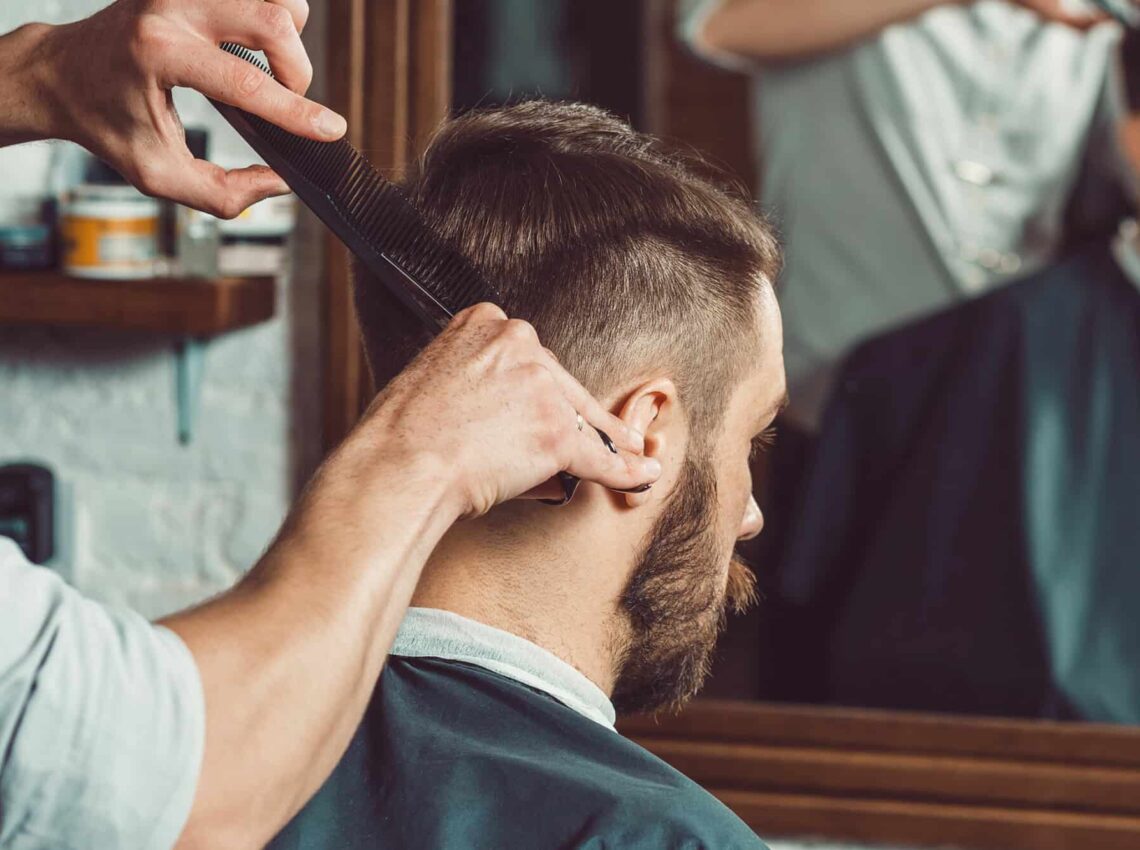 Taper fade cutting technique demonstration showcasing professional barber precision methods and expert blending skills for high fade haircuts