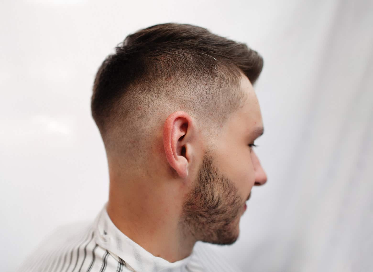 Temple fade haircut | precision temple fade targeting hairline recession with clean professional blend