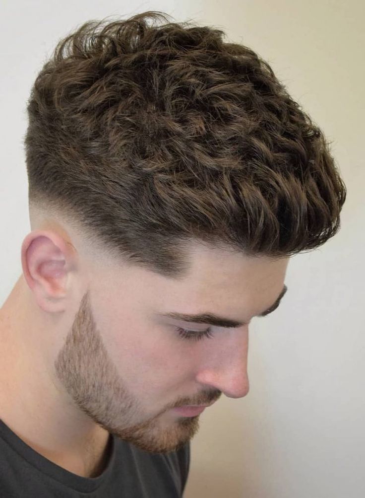 Wavy textured hairstyle showcasing natural wave pattern with medium length and effortless styling