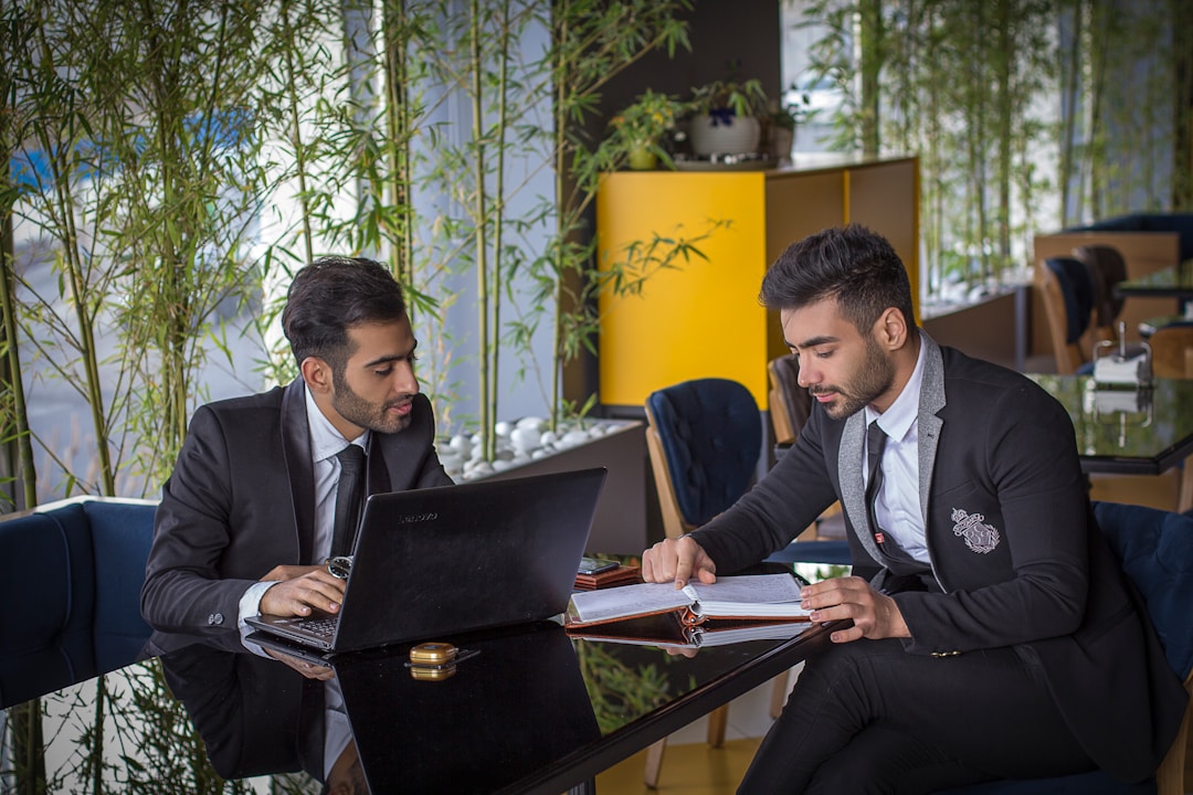 Professional business meeting environment showcasing executive presence enhanced by expert skin fade haircuts from DIDA NYC Hair Studio Queens