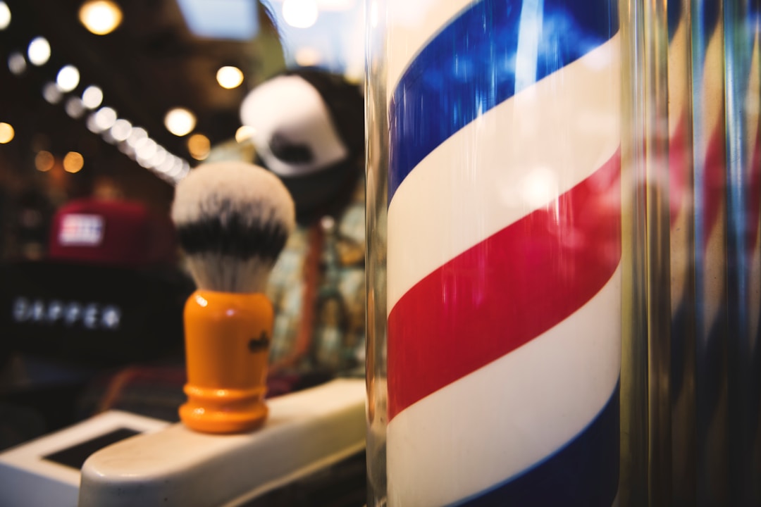 Professional product recommendations for low fades showcasing styling products and maintenance essentials at modern barbershop environment