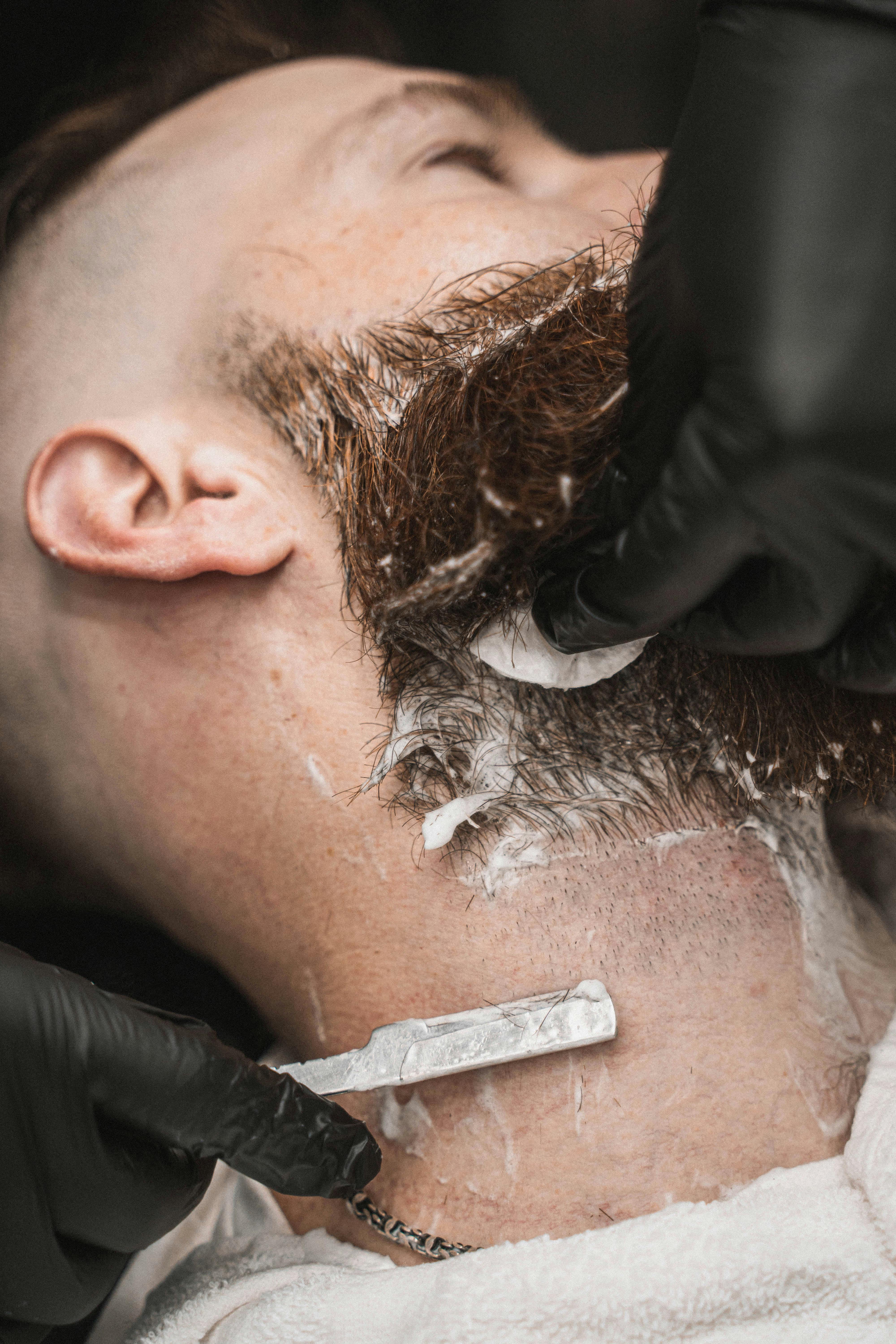 Luxury hot towel shave service at DIDA barbershop Queens NYC - traditional straight razor shaving